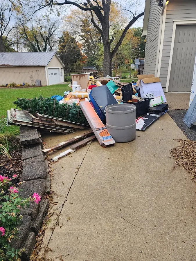 Dumpster being loaded with debris for Commercial Dumpster Rental in Lavon